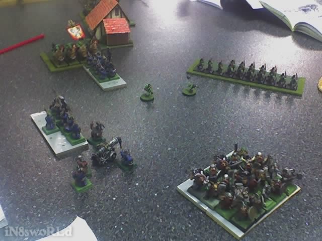 Yelling breaks out in the goblin ranks and a general rush (animosity) toward the enemy begins. Just as they begin to stumble forward, two Goblin fanatics emerge from the throng! The Thunderers, poorly placed from the get-go end up flanked by the Boar riders and unable to fire or even fight effectively while the Longbeards can't even get into the action before they are decimated by one of the fanatics! 02-19-09_2251.jpg