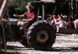 Nate gives kids a ride at Barney's vineyard