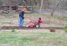 Rototilling to prepare for the raised beds